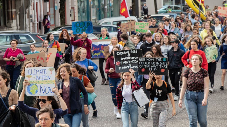 A diverse group of people participating in a peaceful climate protest