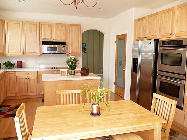 A modern, energy-efficient kitchen with stainless steel appliances bearing the ENERGY STAR label.