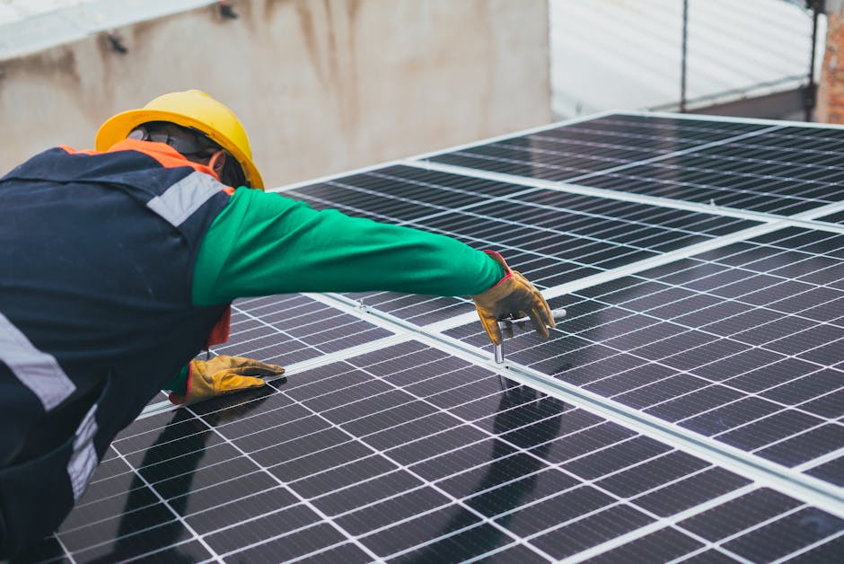 A skilled worker carefully installing solar panels on the roof of a residential home, showcasing the process of transitioning to renewable energy.